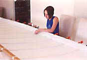 Melissa Beckner sewing the front spar cover